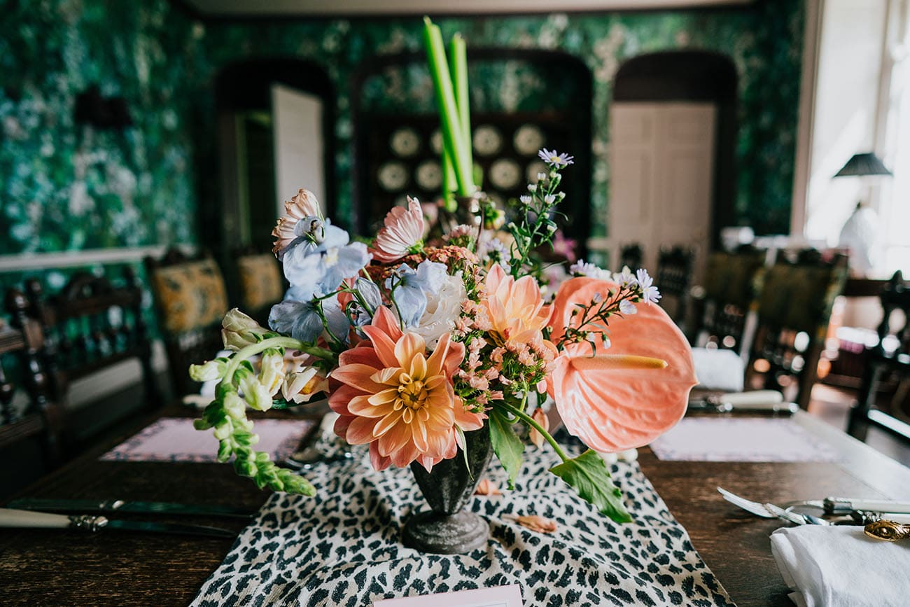 Colourful floral displays takes centre stage on the wedding breakfast table