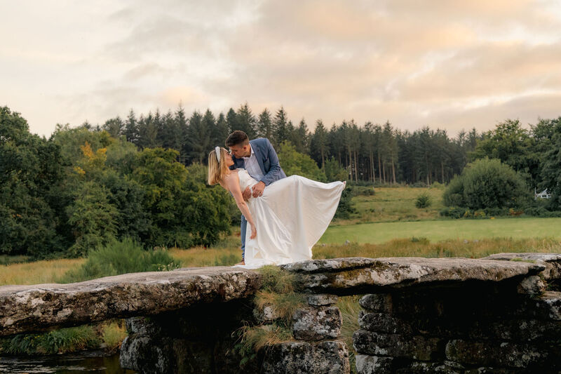Bride and Groom Kissing on a bridge