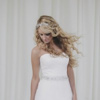 Dress: Ronald Joyce, Headpiece: Sarah Drew