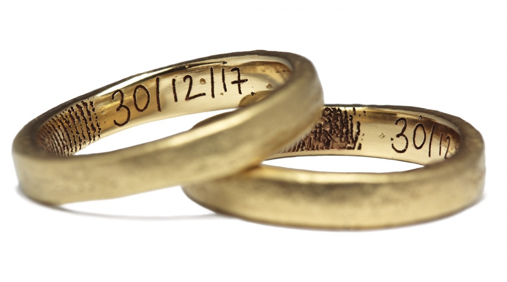 Sandcast Wedding Rings With Fingerprint And Handwritten Engraving White Background WHITE CMYK