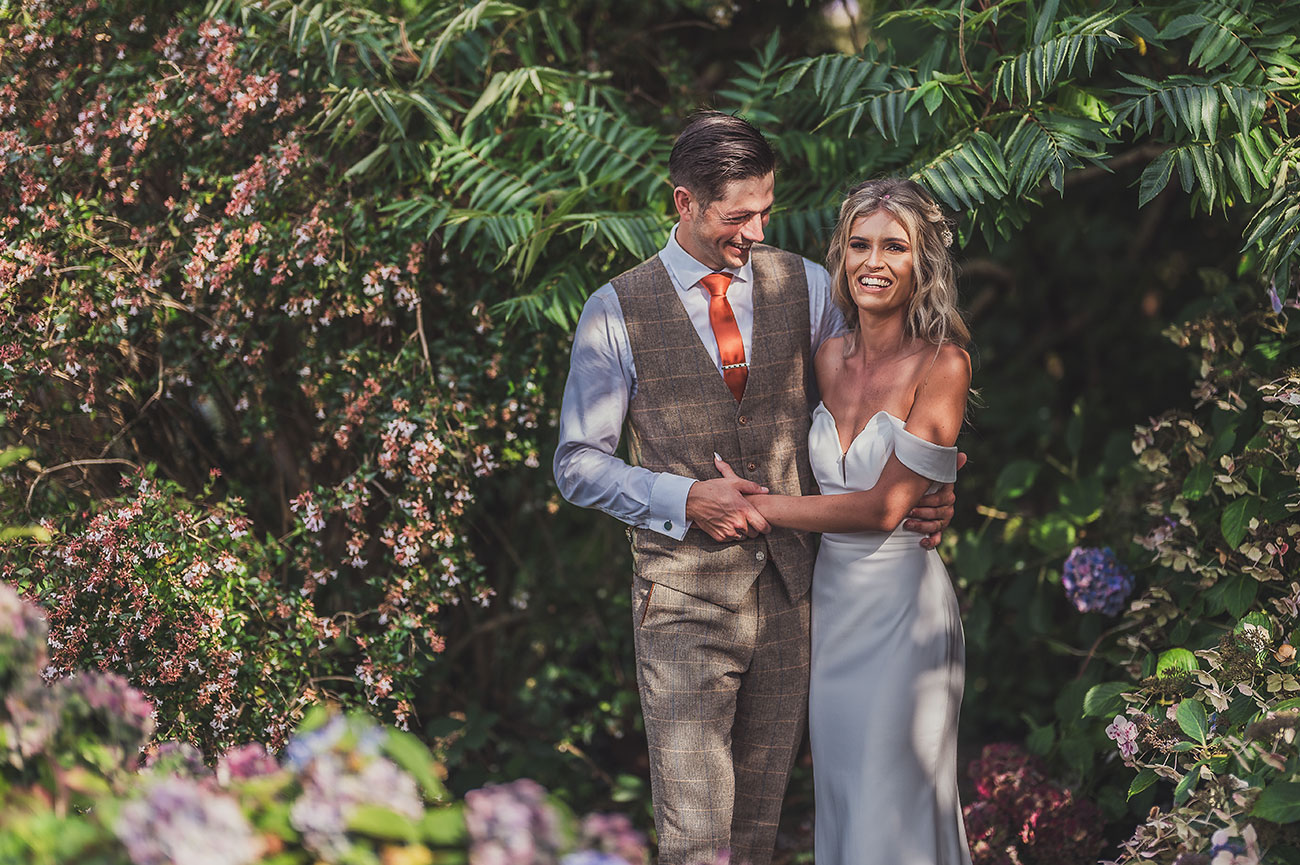 Bride and groom in beautiful gardens