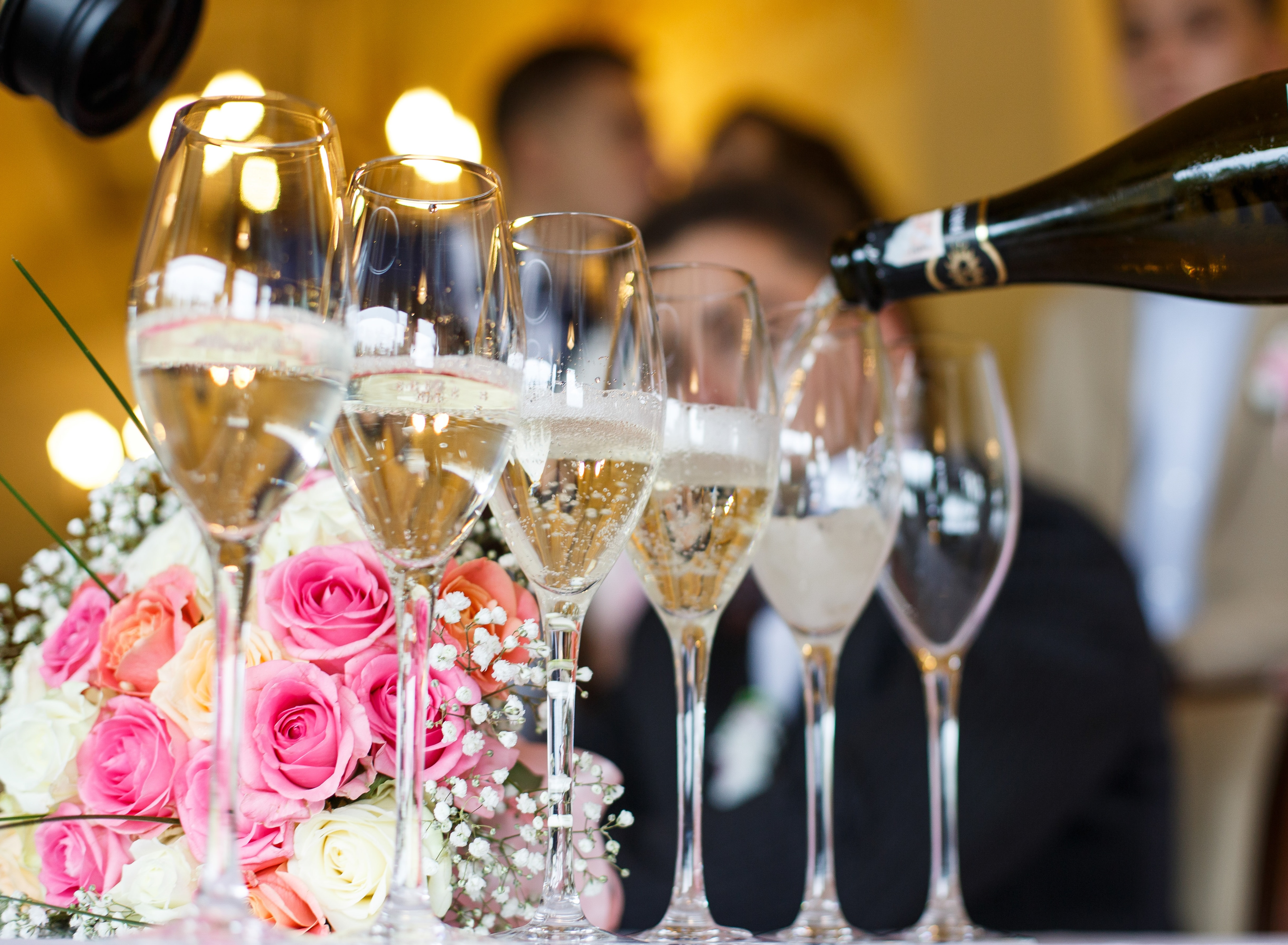 Champagne being poured into glasses